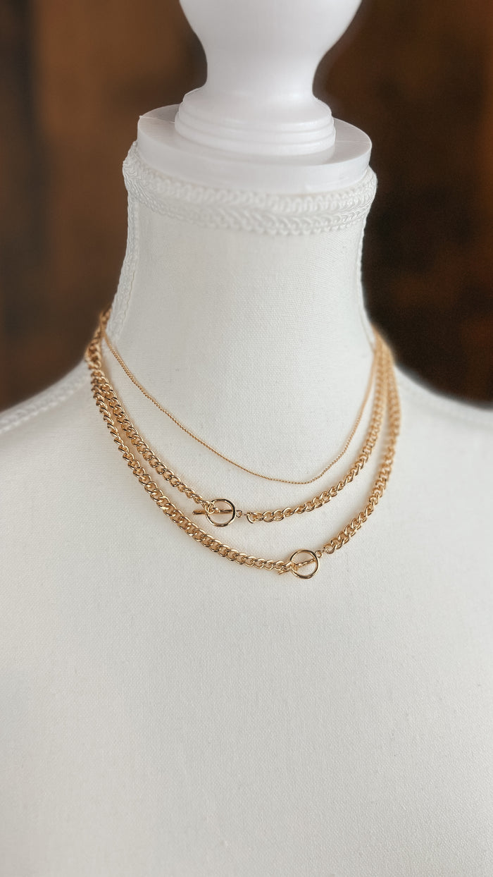 Gold triple chain necklace