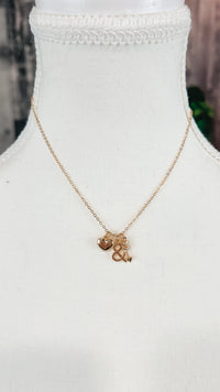 Gold necklace with 3 charms