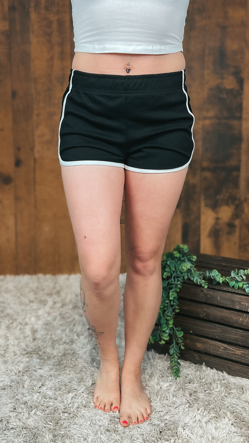 Black dolphin cut shorts with white trim