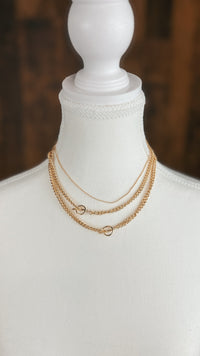 Gold triple chain necklace