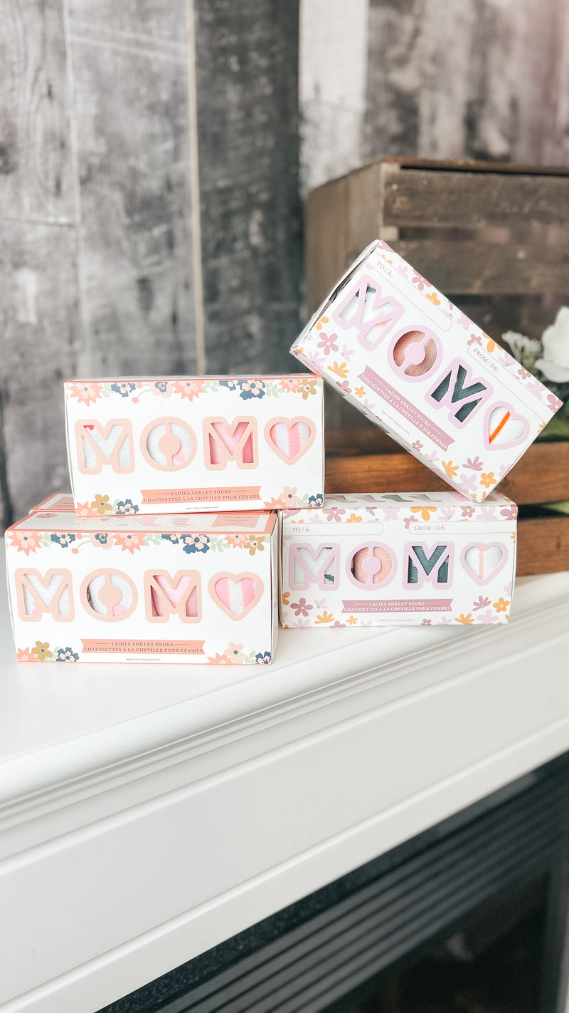 box of women's socks with various prints