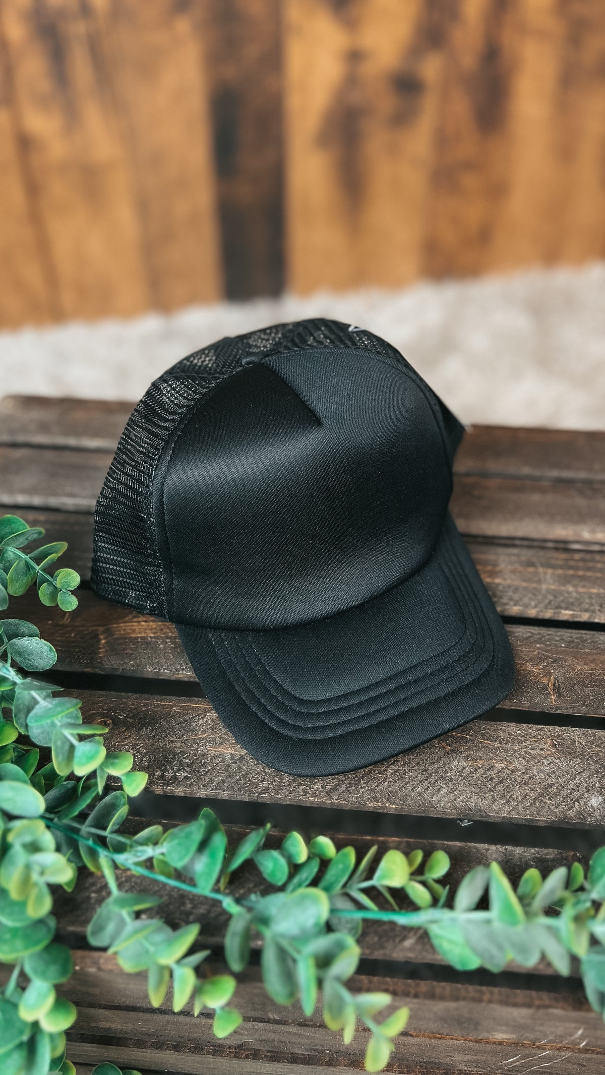 Black mesh back trucker style baseball hat