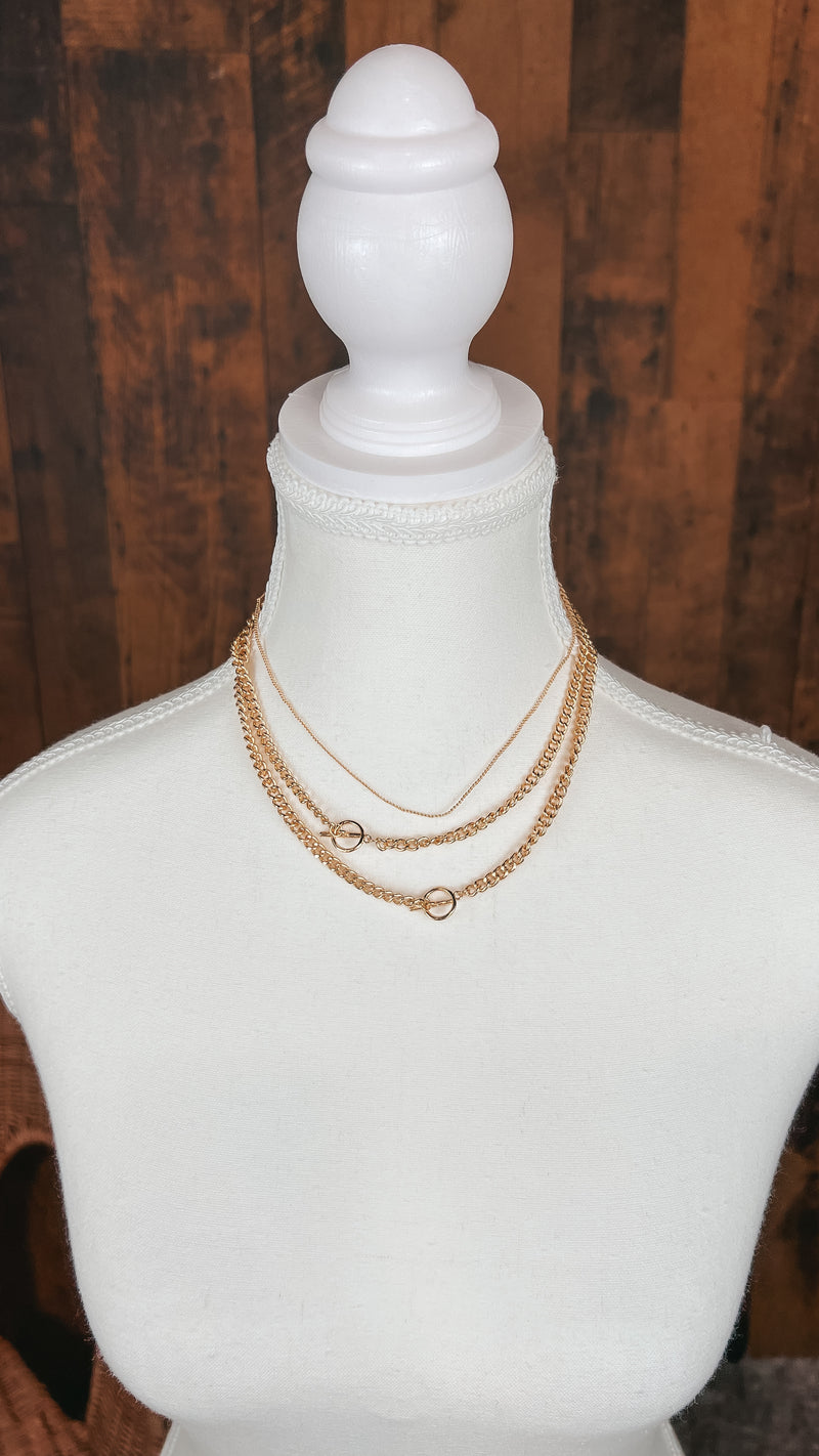 Gold triple chain necklace